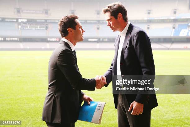 Gavin Wanganeen presents a report to AFL CEO Gillon McLachlan during an Indigenous Past Player Group announcement at Etihad Stadium on June 28, 2018...