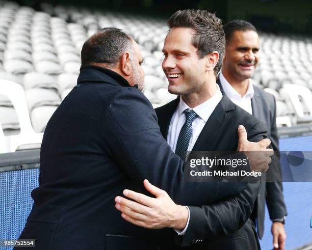 Michael Long, hugged by Gavin Wanganeen makes a suprise appearance from illness during an Indigenous Past Player Group announcement at Etihad Stadium...