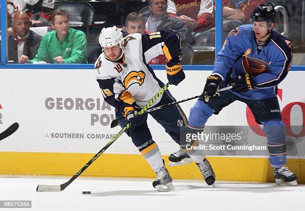 Tim Connolly of the Buffalo Sabres looks to pass against Niclas Bergfors of the Atlanta Thrashers at Philips Arena on March 16, 2010 in Atlanta,...