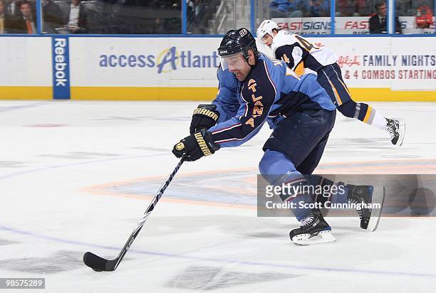 Todd White of the Atlanta Thrashers carries the puck against the Buffalo Sabres at Philips Arena on March 16, 2010 in Atlanta, Georgia.