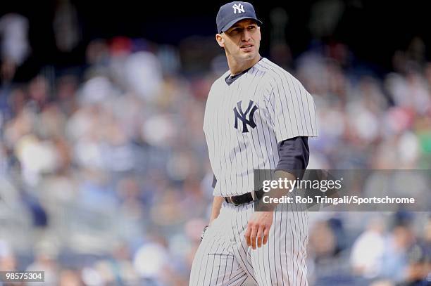 Andy Pettitte of the New York Yankees looks on from the dugout against the Texas Rangers at Yankee Stadium on April 18, 2010 in the Bronx borough of...