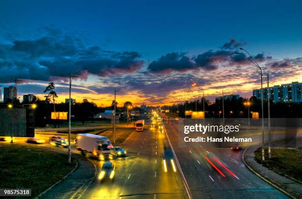 cars passing on a kiev street, kiev ukraine - beca stock-fotos und bilder