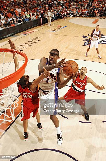 Amare Stoudemire of the Phoenix Suns takes the ball to the basket against Nicolas Batum of the Portland Trail Blazers in Game One of the Western...