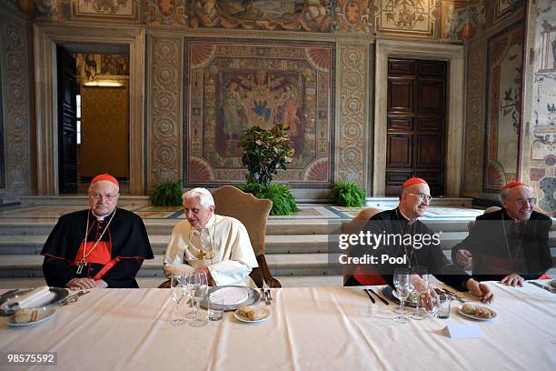 Pope Benedict XVI sits with Italian cardinals Angelo Sodano , Tarcisio Bertone and Giovanni Battista Re during a lunch offered to the cardinals to...