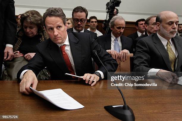 Treasury Secretary Timothy Geithner and Federal Reserve Bank Chairman Ben Bernanke prepare to leave after testifying before the House Financial...