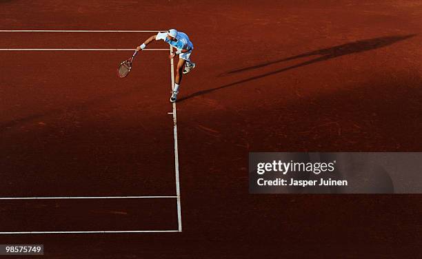 Juan Ignacio Chela of Argentina serves the ball to Robert Soderling of Sweden on day two of the ATP 500 World Tour Barcelona Open Banco Sabadell 2010...