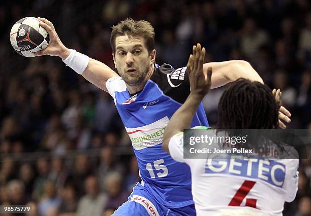 Guillaume Gille of Hamburg scores during the Toyota Handball Bundesliga match between SC Magdeburg and HSV Hamburg at the Boerdeland Hall on April...