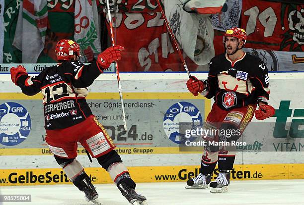 Matt Dzieduszycki of Hannover celebrates after he scores his team's opening goal during the DEL play off final match between Hannover Scorpions and...