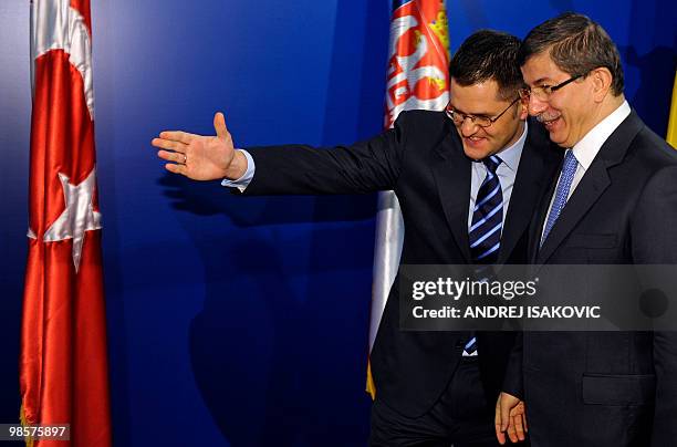 Serbian Foreign Minister Vuk Jeremic welcomes his Turkish counterpart Ahmet Davutoglu prior their meeting in Belgrade on April 20, 2010. AFP PHOTO /...