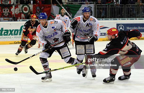 Nikolai Goc of Hannover and Brett Engelhardt of Augsburg battle for the puck during the DEL play off final match between Hannover Scorpions and...