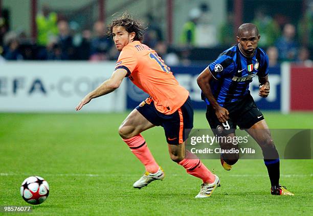 Samuel Eto'o of Inter Milan competes for the ball with Maxwell of Barcelona during the UEFA Champions League Semi Final First Leg match between Inter...