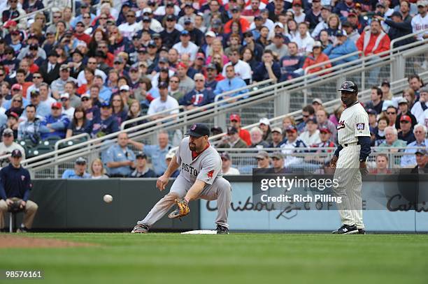 Kevin Youkilis of the Boston Red Sox fields during the Opening Day game against the Minnesota Twins at Target Field in Minneapolis, Minnesota on...