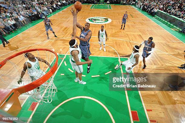 Theo Ratliff of the Charlotte Bobcats puts a shot up against Rasheed Wallace of the Boston Celtics on March 3, 2010 at the TD Garden in Boston,...