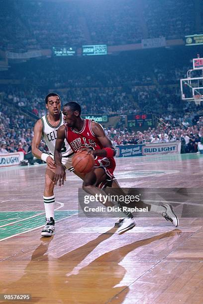 Michael Jordan of the Chicago Bulls drives to the basket against Dennis Johnson of the Boston Celtics during a game played in 1987 at the Boston...
