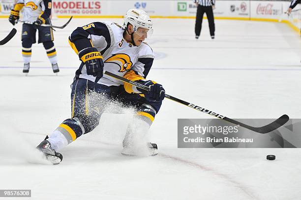 Toni Lydman of the Buffalo Sabers skates after the puck against the Boston Bruins in Game Three of the Eastern Conference Quarterfinals during the...