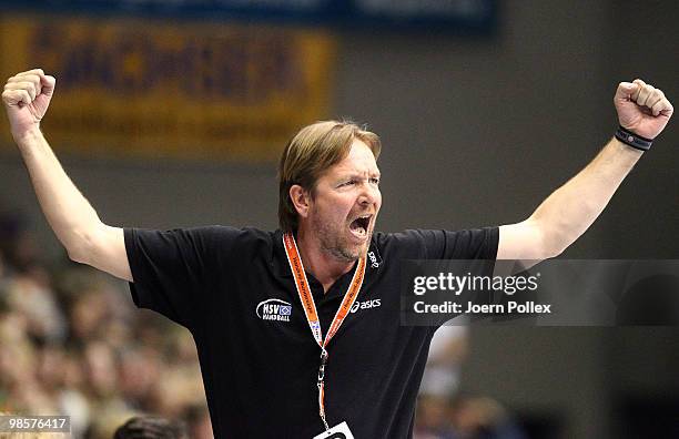 Head coach Martin Schwalb of Hamburg celebrates during the Toyota Handball Bundesliga match between SC Magdeburg and HSV Hamburg at the Boerdeland...