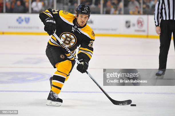 Andrew Ference of the Boston Bruins passes the puck against the Buffalo Sabers in Game Three of the Eastern Conference Quarterfinals during the 2010...