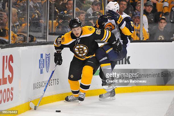 Vladimir Sobotka of the Boston Bruins skates after the puck against Toni Lydman of the Buffalo Sabers in Game Three of the Eastern Conference...