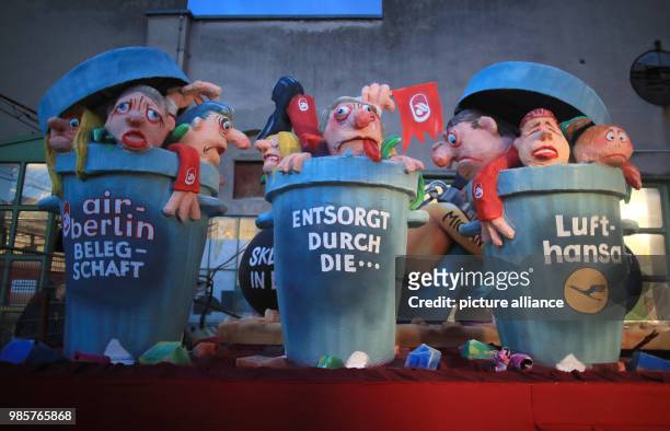 Political caricature float depicting the "Air Berlin takeover of Lufthansa" is prepared for the Rosenmontag carnival procession...
