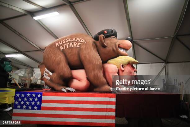 Political caricature float featuring a "Russian bear" on top of the figure of "Donald Trump, the 45th president of the United States" is prepared for...