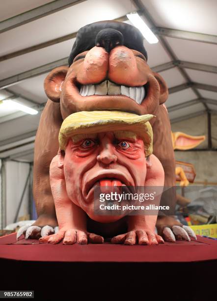 Political caricature float featuring a "Russian bear" on top of the figure of "Donald Trump, the 45th president of the United States" is prepared for...