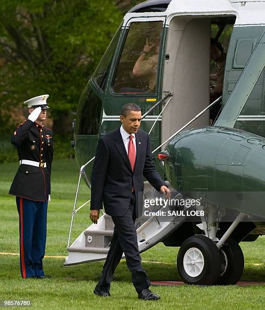 President Barack Obama walks from Marine One after arriving on the South Lawn of the White House in Washington, DC, April 20, 2010. Obama traveled to...