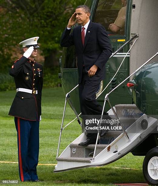 President Barack Obama walks from Marine One after arriving on the South Lawn of the White House in Washington, DC, April 20, 2010. Obama traveled to...