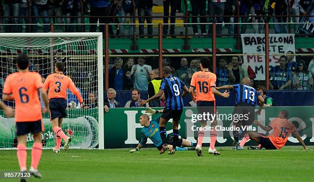 Maicon of Inter Milan scores the 2:1 goal past Barcelona goalkeeper Victor Valdes during the UEFA Champions League Semi Final First Leg match between...