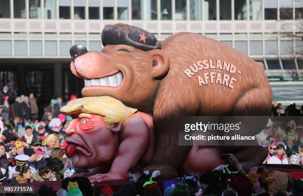 Political caricature float featuring a "Russian bear" on top of the figure of "Donald Trump, the 45th president of the United States" taking part in...