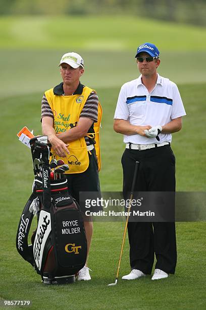 Bryce Molder stands alongside his caddie during the final round of the Shell Houston Open at Redstone Golf Club on April 4, 2010 in Humble, Texas.