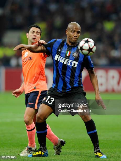 Maicon of Inter Milan in action against Xavi Hernandez of Barcelona during the UEFA Champions League Semi Final First Leg match between Inter Milan...
