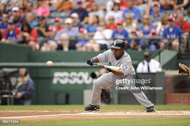 Chone Figgins of the Seattle Mariners bats and attempts to bunt for a base hit during the game against the Texas Rangers at Rangers Ballpark in...