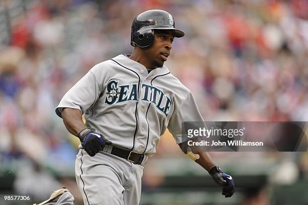Chone Figgins of the Seattle Mariners runs to first base after hitting the ball during the game against the Texas Rangers at Rangers Ballpark in...