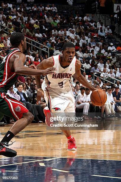 Joe Johnson of the Atlanta Hawks drives to the basket against John Salmons of the Milwaukee Bucks in Game One of the Eastern Conference Quarterfinals...