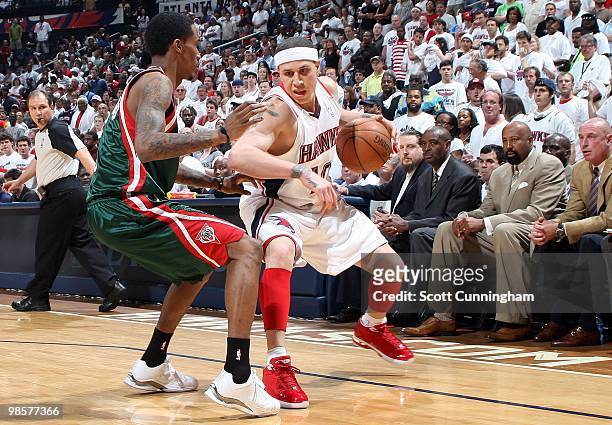 Mike Bibby of the Atlanta Hawks makes a move against Brandon Jennings of the Milwaukee Bucks in Game One of the Eastern Conference Quarterfinals...