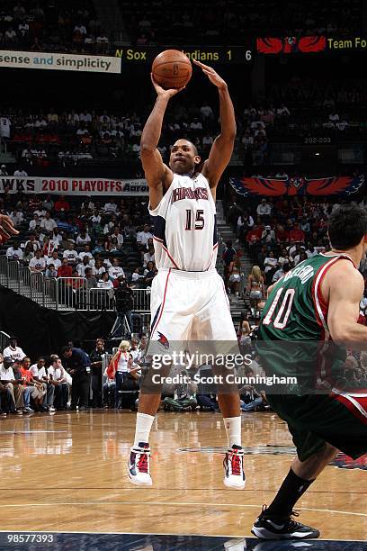 Al Horford of the Atlanta Hawks shoots a jump shot against Carlos Delfino of the Milwaukee Bucks in Game One of the Eastern Conference Quarterfinals...