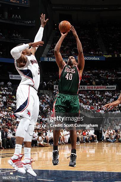 Kurt Thomas of the Milwaukee Bucks shoots a jump shot against Josh Smith of the Atlanta Hawks in Game One of the Eastern Conference Quarterfinals...