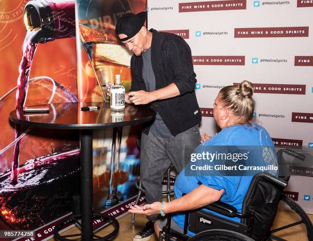 Actor Channing Tatum signs bottles of Born And Bred Vodka on June 27, 2018 in Hummelstown, Pennsylvania.