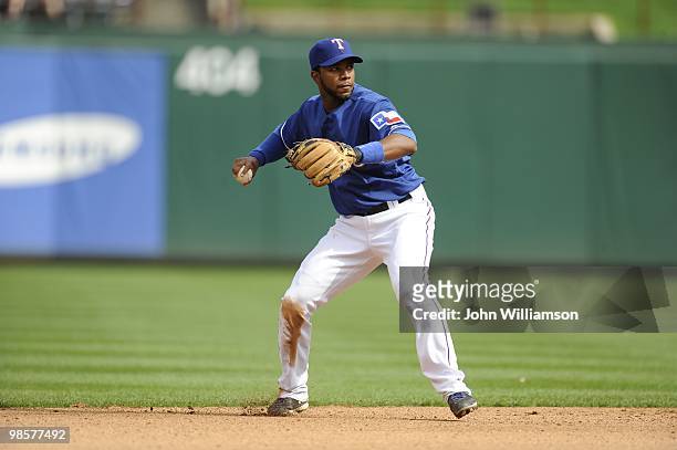 Shortstop Elvis Andrus of the Texas Rangers fields his position as he throws to first base for an out after catching a ground ball during the game...