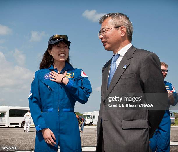 In this photo provided by NASA, Japanese astronaut Naoko Yamazaki, left, and Dr. Kuniaki Shiraki, Executive Director, Japan Aerospace Exploration...