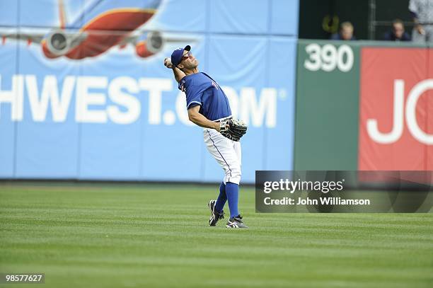 Left fielder David Murphy of the Texas Rangers fields his position as he throws home in time to beat the baserunner trying to score from second base...