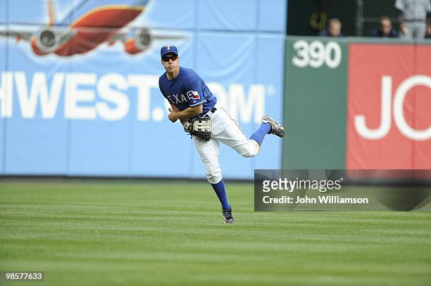 Left fielder David Murphy of the Texas Rangers fields his position as he throws home in time to beat the baserunner trying to score from second base...