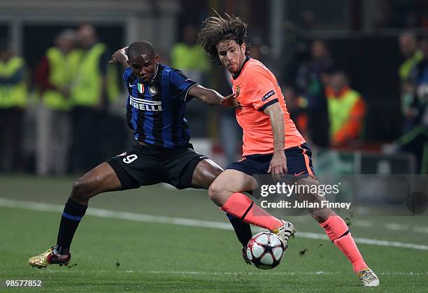 Samuel Eto'o of Inter battles with Maxwell of Barcelona during the UEFA Champions League Semi Final 1st Leg match between Inter Milan and Barcelona...