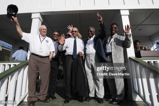 Baseball Hall of Famers wave to fans following ceremonies opening the Hank Aaron Museum at the Hank Aaron Stadium on April 14, 2010 in Mobile,...