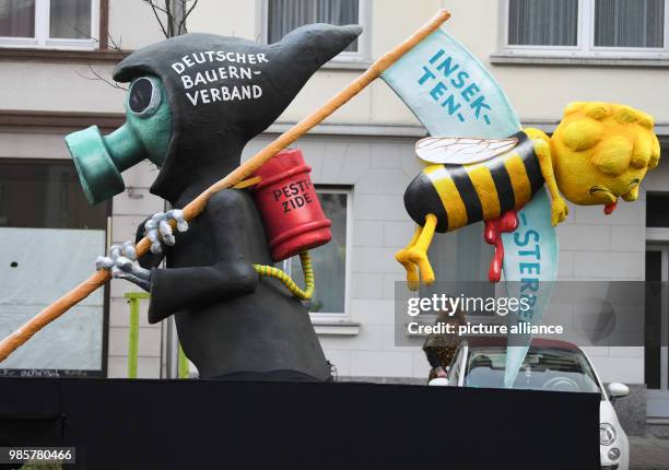 Political caricature float depicting the "Deutscher Bauern Verband " takes part in the Rosenmontag carnival procession in Duesseldorf, Germany, 12...