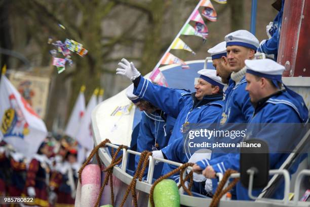 Carnival sailors throw sweets during the Rosenmontag carnival procession in Mainz, Germany, 12 Febraury 2018. The 'Rosenmontagsumzug' is the...