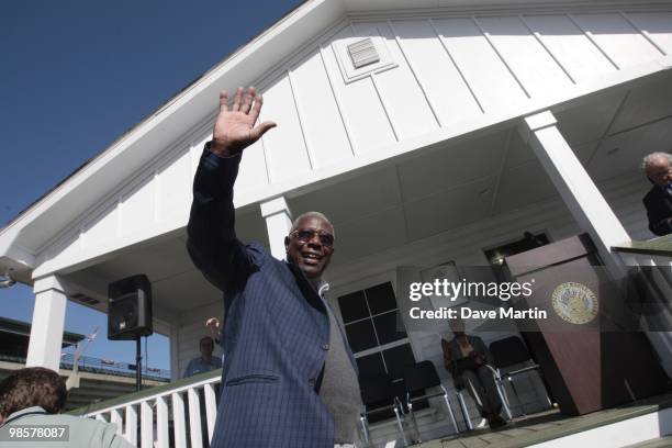 Hank Aaron waves to fans as he arrives prior to ceremonies opening the Hank Aaron Museum at the Hank Aaron Stadium on April 14, 2010 in Mobile,...