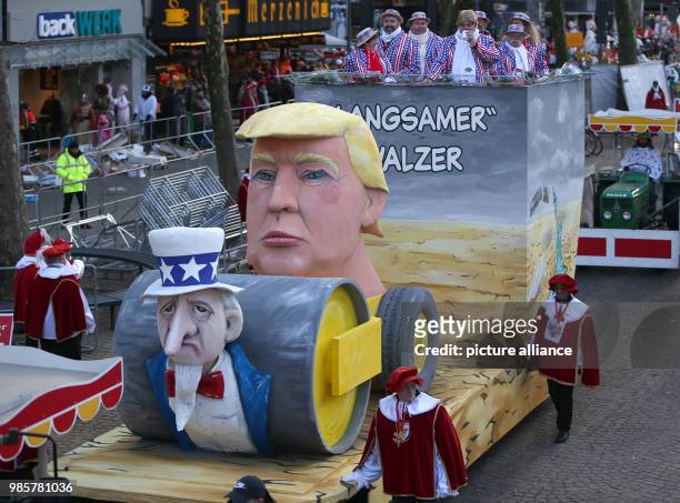 Political caricature float featuring Donald Trump, the 45th President of the United States, takes part in the Rosenmontag carnival procession...