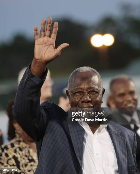 Hall of Famer Hank Aaron waves to fans during pre-game ceremonies following the opening the Hank Aaron Museum at the Hank Aaron Stadium on April 14,...