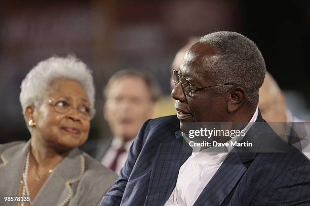 Hall of Famer Hank Aaron sits with is wife Billye Aaron during pre-game ceremonies following the opening of the Hank Aaron Museum at the Hank Aaron...